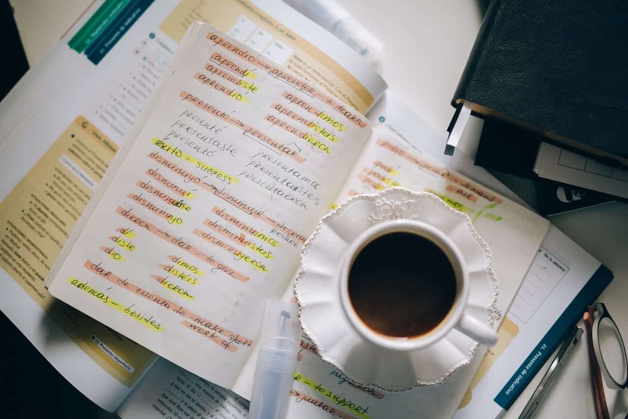 Coffee cup beside foreign language notes representing Australian-owned translation service