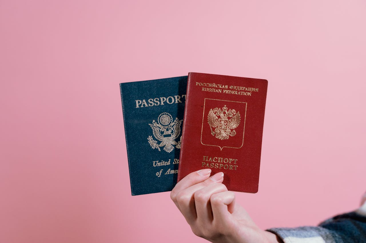 Person holding passport for NAATI translation Australian visa