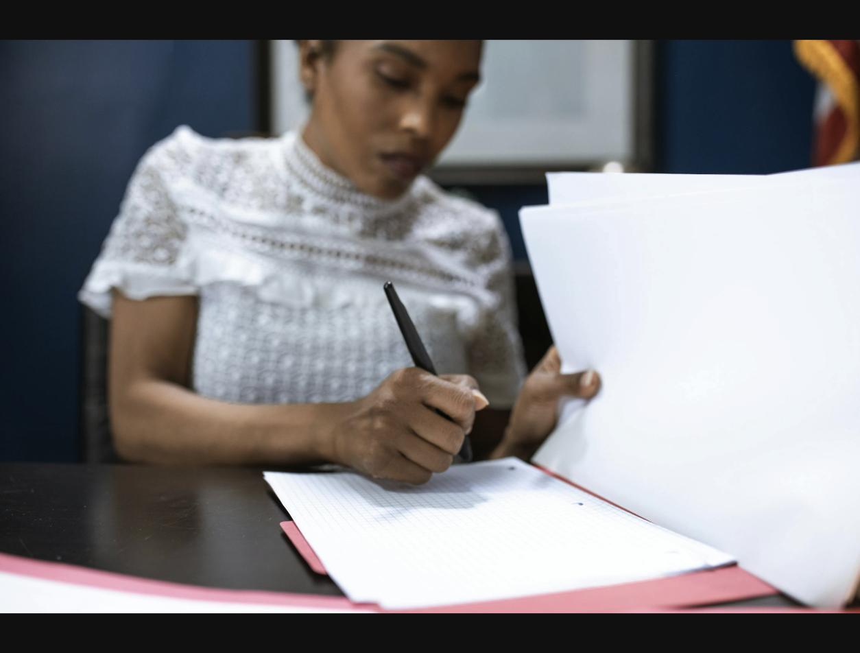 Person reviewing NAATI certified translation documents for Australian visa