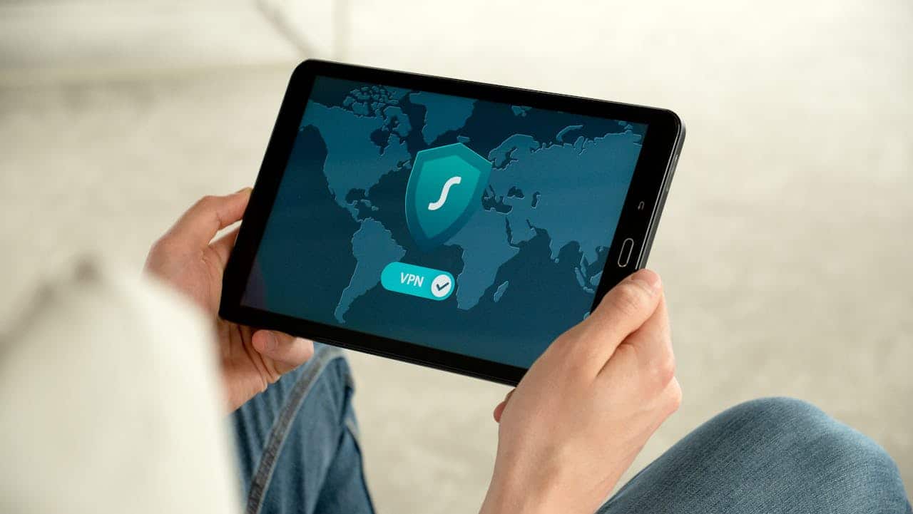Person holding tablet representing Australian Privacy Act protections for immigration documents