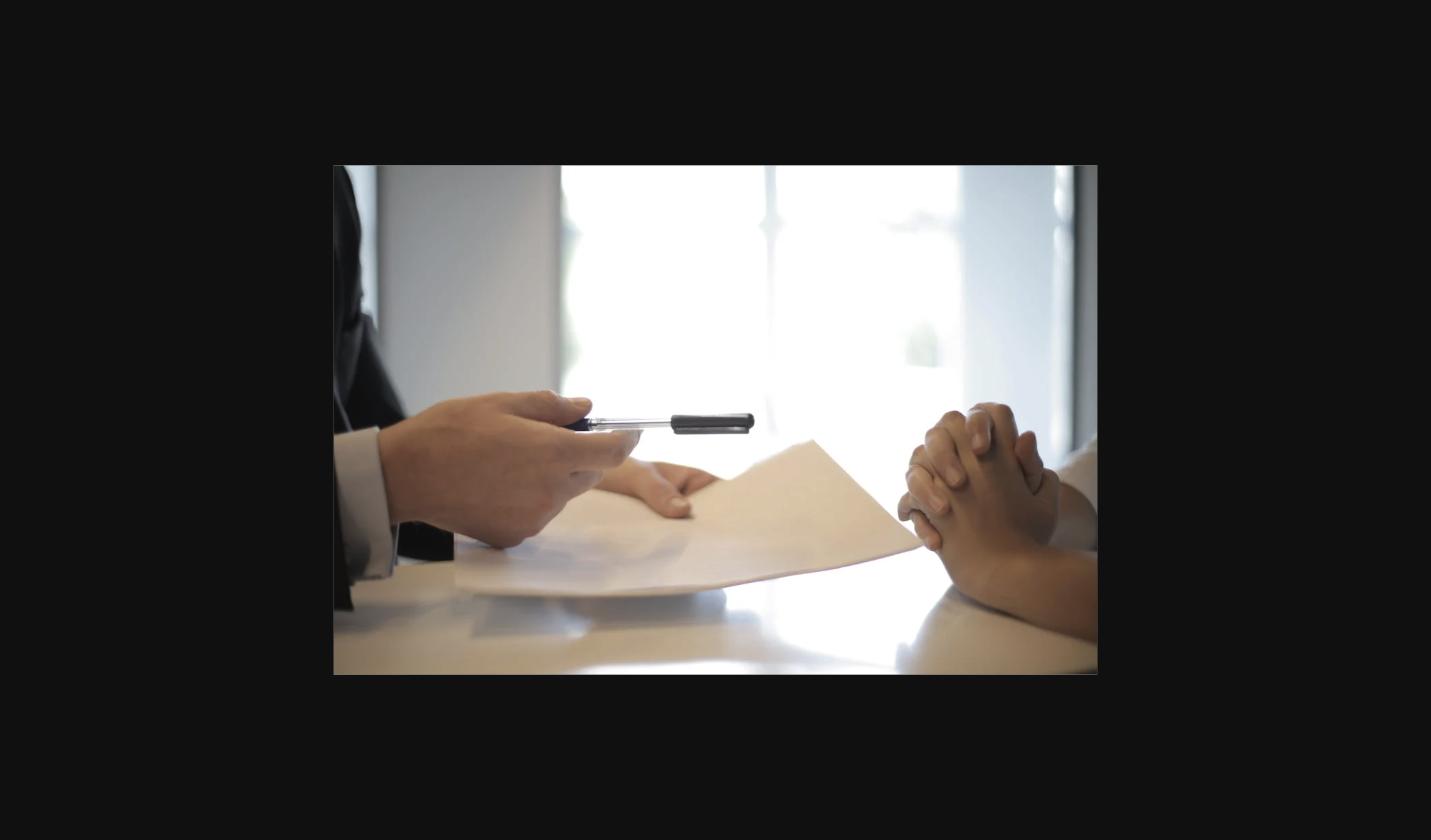 Person handing over fast certified translation document same day Australia